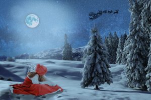 雪の中サンタを見つめる赤い服の女の子